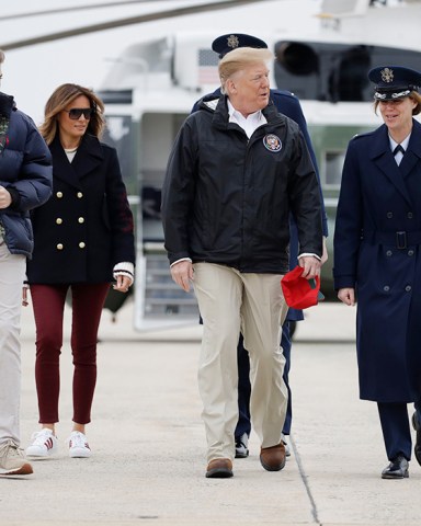 President Donald Trump, first lady Melania Trump and their son Barron Trump, walk to board Air Force One, in Andrews Air Force Base, Md., en route to Lee County, Ala., where tornados killed 23 people
Trump, Andrews Air Force Base, USA - 08 Mar 2019