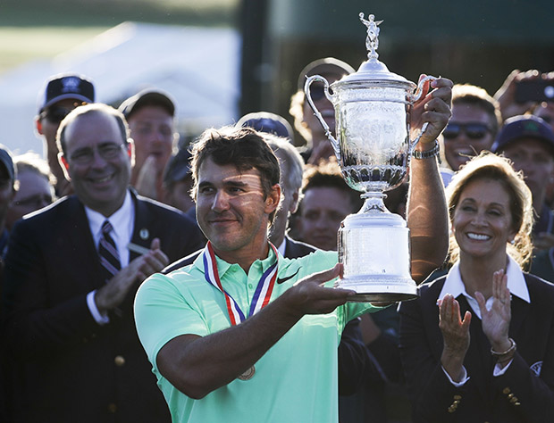 Copyright 2017 The Associated Press. All rights reserved. This material may not be published, broadcast, rewritten or redistributed without permission.
Mandatory Credit: Photo by AP/REX/Shutterstock (8872026fg)
Brooks Koepka holds up the winning trophy after the U.S. Open golf tournament, at Erin Hills in Erin, Wis
US Open Golf, Erin, USA - 18 Jun 2017