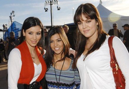 From left, television personalities Kim, Kourtney and Khloe Kardashian participate in the 2nd Annual DirecTV Celebrity Beach Bowl presented by Spike, Thursday, Jan. 31, 2008 in Scottsdale, Ariz. (AP Photo/Evan Agostini)