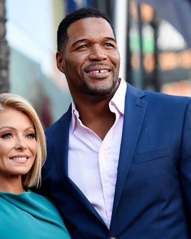 Kelly Ripa, left, poses with Michael Strahan, her co-host on the daily television talk show "LIVE! with Kelly and Michael," during a ceremony honoring Ripa with a star on the Hollywood Walk of Fame in Los Angeles. Strahan says goodbye to his daytime talk show with Kelly Ripa, an exit accelerated by awkwardness surrounding the announcement of his new job at "Good Morning America
TV-ABC Strahan, Los Angeles, USA