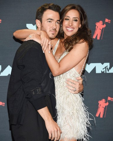 Kevin Jonas, Danielle Deleasa. Kevin Jonas, left, and Danielle Deleasa pose in the press room at the MTV Video Music Awards at the Prudential Center, in Newark, N.J2019 MTV Video Music Awards - Press Room, Newark, USA - 26 Aug 2019