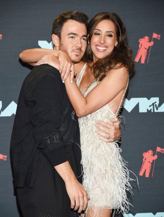 Kevin Jonas, Danielle Deleasa. Kevin Jonas, left, and Danielle Deleasa pose in the press room at the MTV Video Music Awards at the Prudential Center, in Newark, N.J2019 MTV Video Music Awards - Press Room, Newark, USA - 26 Aug 2019