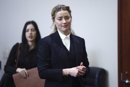 Actor Amber Heard arrives in the courtroom at the Fairfax County Circuit Court in Fairfax, Va.,.  Actor Johnny Depp sued his ex-wife Amber Heard for libel in Fairfax County Circuit Court after she wrote an op-ed piece in The Washington Post in 2018 referring to herself as a "public figure representing domestic abuse Depp Heard Lawsuit, Fairfax, United States - Apr 21 2022