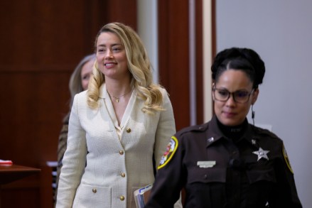 Actress Amber Heard arrives in the courtroom at the Fairfax County Circuit Court in Fairfax, Va.,.  Actor Johnny Depp sued his ex-wife Amber Heard for libel in Fairfax County Circuit Court after she wrote an op-ed piece in The Washington Post in 2018 referring to herself as a "public figure representing domestic abuse Depp Heard Lawsuit, Fairfax, United States - Apr 20 2022