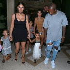 Kim Kardashian and Kourtey take the family to dinner at a house in cuba as she wears sexy dress and North holds a leaf in hand
