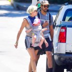EXCLUSIVE: Kristen Wiig and her husband Avi Rothman take a morning hike with their twins