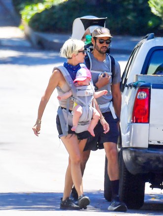 EXCLUSIVE: Kristen Wiig and her husband Avi Rothman take a morning hike with their twins. Kristen and her husband were seen taking a morning hike in the Pasadena mountains. The pair each were seen carrying their babies in different carriers as they enjoyed the beautiful weather. **SPECIAL INSTRUCTIONS*** Please pixelate children's faces before publication.***. 29 Aug 2020 Pictured: Kristen Wiig and Avi Rothman. Photo credit: Snorlax / MEGA TheMegaAgency.com +1 888 505 6342 (Mega Agency TagID: MEGA697294_007.jpg) [Photo via Mega Agency]