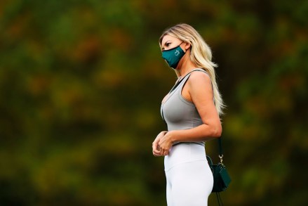 Dustin Johnson's wife, Paulina Gretzky, watches her husband during the first round of the Masters golf tournament Thursday, Nov. 12, 2020, in Augusta, Ga. (AP Photo/David J. Phillip)
