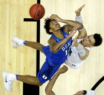 Duke guard Brandon Ingram, left, is fouled by Oregon forward Dillon Brooks during the second half of an NCAA college basketball game in the regional semifinals of the NCAA Tournament, in Anaheim, Calif
NCAA Duke Oregon Basketball, Anaheim, USA