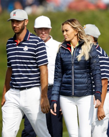 Dustin Johnson of the US, left, walks with his partner Paulina Gretzky on 16th green at the end of a fourball match on the opening day of the 42nd Ryder Cup at Le Golf National in Saint-Quentin-en-Yvelines, outside Paris, France, . Johnson and Fowler won 4 and 2 over Europe's Rory McIlroy and Thorbjorn Olesen Ryder Cup Golf, Saint-Quentin-en-Yvelines, France - 28 Sep 2018