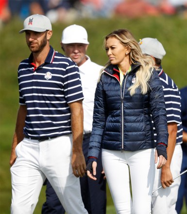 Dustin Johnson of the US, left, walks with his partner Paulina Gretzky on 16th green at the end of a fourball match on the opening day of the 42nd Ryder Cup at Le Golf National in Saint-Quentin-en-Yvelines, outside Paris, France, . Johnson and Fowler won 4 and 2 over Europe's Rory McIlroy and Thorbjorn Olesen
Ryder Cup Golf, Saint-Quentin-en-Yvelines, France - 28 Sep 2018