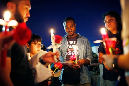 Maurice Forbes, center, holds a candle with others during a vigil at The Center, a community center for the LGBT community, in Las Vegas. The vigil was for the victims of the Pulse nightclub shooting in Orlando
Nightclub Shooting Las Vegas Vigil, Las Vegas, USA