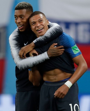 France's Kylian Mbappe, right, and Presnel Kimpembe celebrate at the end of the semifinal match between France and Belgium at the 2018 soccer World Cup in the St. Petersburg Stadium, in St. Petersburg, Russia, . France won 1-0Russia Soccer WCup France Belgium, St. Petersburg, Russian Federation - 10 Jul 2018