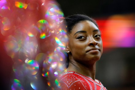 Simone Biles of the U.S. talks to other gymnasts as she warms up on the second and last day of the apparatus finals of the Gymnastics World Championships at the Aspire Dome in Doha, Qatar
Gymnastics World Championships, Doha, Qatar - 03 Nov 2018