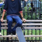 Tony Hawk Sits On A Park Bench While Filming An Untitled Project In NYC