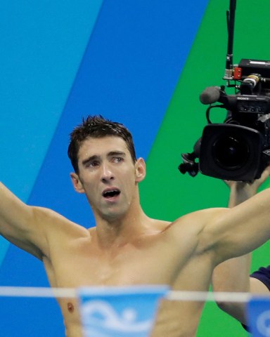 United States Michael Phelps acknowledges the crowd after his team won gold in the men's 4 x 100-meter medley relay final during the swimming competitions at the 2016 Summer Olympics, in Rio de Janeiro, Brazil
Rio Olympics Swimming, Rio de Janeiro, Brazil - 13 Aug 2016
