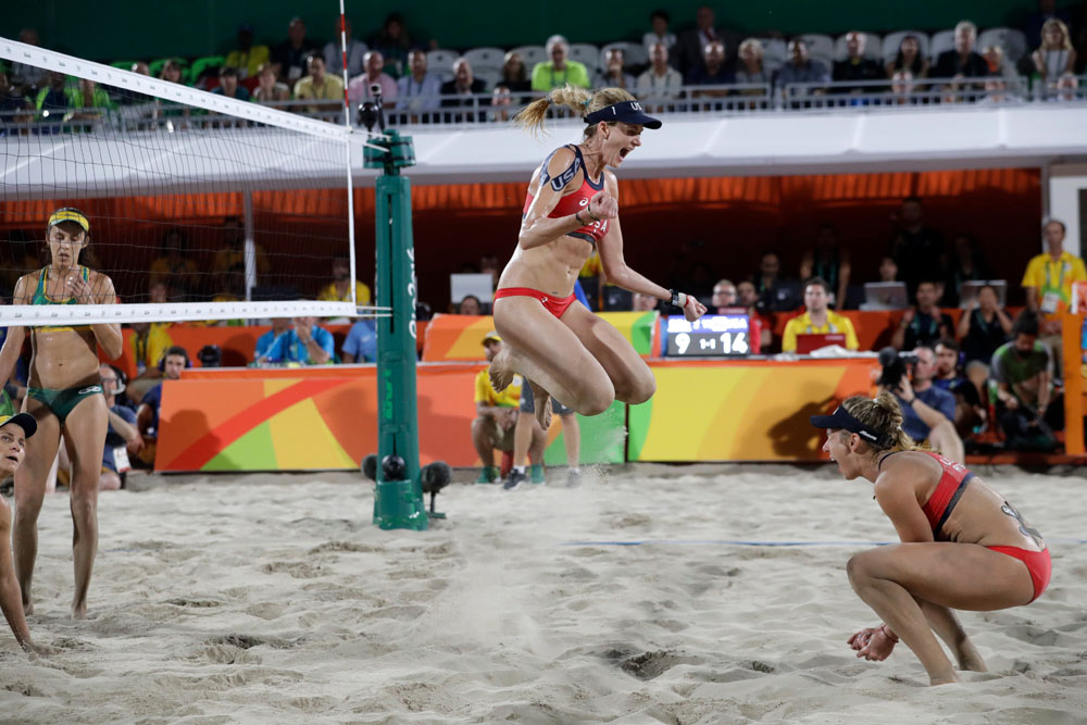 United States' Kerri Walsh Jennings, center, celebrates with teammate April Ross, right, after defeating Brazil during the women's beach volleyball bronze medal match of the 2016 Summer Olympics in Rio de Janeiro, Brazil
Rio 2016 Olympic Games, Beach Volleyball, Brazil - 17 Aug 2016