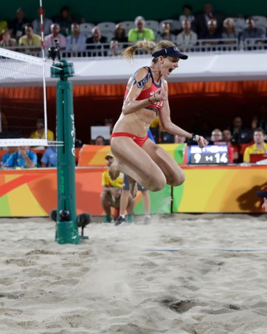 United States' Kerri Walsh Jennings, center, celebrates with teammate April Ross, right, after defeating Brazil during the women's beach volleyball bronze medal match of the 2016 Summer Olympics in Rio de Janeiro, Brazil
Rio 2016 Olympic Games, Beach Volleyball, Brazil - 17 Aug 2016