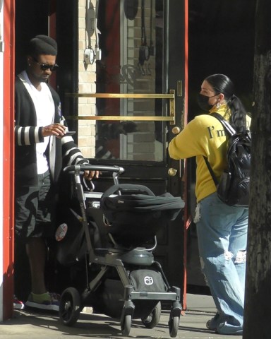 Los Feliz, CA  - *EXCLUSIVE*  - Usher and his girlfriend Jenn Goicoechea enjoy some family time as they step out for lunch with their daughter Sovereign and their newborn baby.  Pictured: Usher, Jenn Goicoechea  BACKGRID USA 17 OCTOBER 2021   USA: +1 310 798 9111 / usasales@backgrid.com  UK: +44 208 344 2007 / uksales@backgrid.com  *UK Clients - Pictures Containing Children Please Pixelate Face Prior To Publication*
