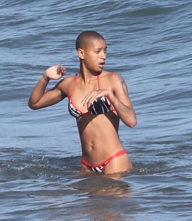 *EXCLUSIVE* Malibu, CA - Actress and singer Willow Smith and her new male companion share a fun cigarette before cooling off in the ocean together and exchanging phone numbers before going their separate ways.  Pictured: Willow Smith BACKGRID USA JUNE 24, 2022 BYLINE SHOULD READ: RMBI / BACKGRID USA: +1 310 798 9111 / usasales@backgrid.com UK: +44 208 344 2007 / uksales@backgrid.com * Pictures Containing Clients Children - com .  Pixelated face before publication*