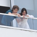 Rolling Stones frontman Mick Jagger and girlfriend Melanie Hamrick enjoy the view from their Miami Beach hotel balcony
