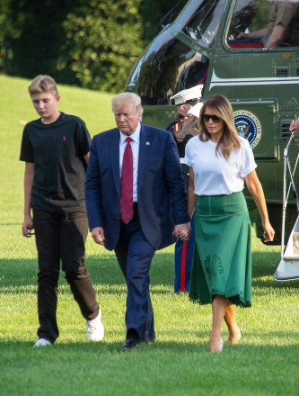 US President Donald Trump, Barron Trump and First Lady Melania Trump, return from their summer vacation to their New Jersey home and golf resort in Bedminster NJ. The Presidents son, Barron now towers over his father
US President Donald Trump returns to the White House, Washington DC, USA - 18 Aug 2019