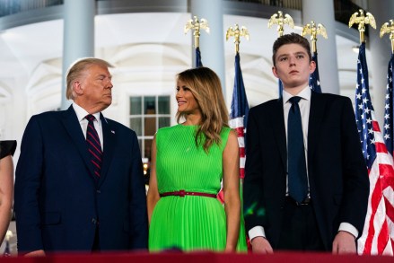 Barron Trump right, stands with President Donald Trump and first lady Melania Trump on the South Lawn of the White House on the fourth day of the Republican National Convention in Washington
Virus Outbreak Melania Trump, Washington, United States - 27 Aug 2020