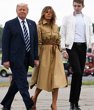 President Donald Trump, first lady Melania Trump and their son, Barron Trump, walk off from Marine One to Air Force One at Morristown Municipal Airport in Morristown, N.J., Sunday, Aug. 16, 2020. Trump was returning to Washington after spending the weekend at Trump National Golf Club. (AP Photo/Susan Walsh)