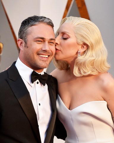 (L-R) Taylor Kinney and Lady Gaga attend the 88th Academy Awards in Los Angeles, CA, USA, February 28, 2016. Photo by Lionel Hahn/Sipa USA