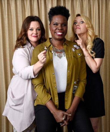 Melissa McCarthy, left, Leslie Jones, center, and Kate McKinnon, cast members in "Ghostbusters," pose with a Lego toy figure of fellow cast member Kristen Wiig during a portrait session at the Four Seasons Hotel in Los Angeles. Their film will be released on Friday
"Ghostbusters" Portrait Session, Los Angeles, USA