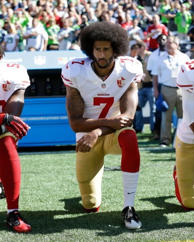 San Francisco 49ers' Colin Kaepernick kneels during the national anthem before an NFL football game against the Seattle Seahawks in Seattle. The same guys who banished Kaepernick from the league for kneeling during the anthem to raise awareness about those very same issues have ruthlessly commandeered his cause
Paul Newberry The Kaepernick Effect, Seattle, USA - 25 Sep 2016