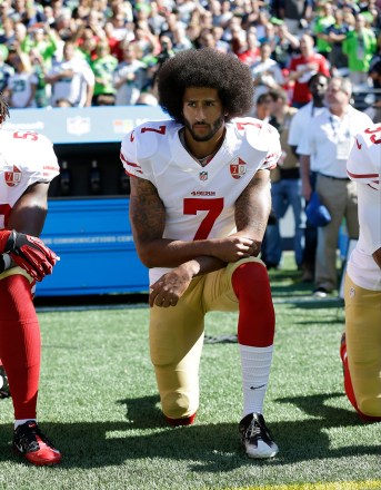 Colin Kaepernick of the San Francisco 49ers kneels during the national anthem before an NFL football game against the Seattle Seahawks in Seattle.  The same guys who banished Kaepernick from the league for taking a knee during the anthem to raise awareness of those same issues have ruthlessly taken over his cause Paul Newberry The Kaepernick Effect, Seattle, USA - September 25, 2016