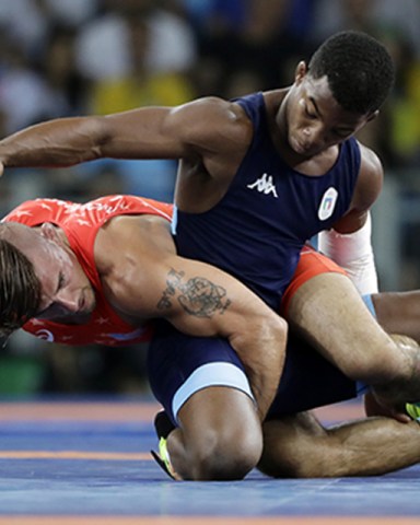 Copyright 2016 The Associated Press. All rights reserved. This material may not be published, broadcast, rewritten or redistributed without permission.Mandatory Credit: Photo by Marcio Jose Sanchez/AP/REX/Shutterstock (5837904ab)United States' Frank Molinaro, bottom, and Italy's Frank Chamiso Marquez compete during the men's 65-kg freestyle bronze medal wrestling match at the 2016 Summer Olympics in Rio de Janeiro, BrazilRio 2016 Olympic Games, Wrestling, Carioca Arena 2, Brazil - 21 Aug 2016