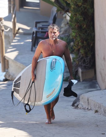Santa Barbara, CA  - *EXCLUSIVE*  - Shirtless Rob Lowe shows off this toned body and his cupping bruises after a Paddleboarding session in Santa Barbara.Pictured: Rob LoweBACKGRID USA 28 JUNE 2021 BYLINE MUST READ: ShotbyJuliann / BACKGRIDUSA: +1 310 798 9111 / usasales@backgrid.comUK: +44 208 344 2007 / uksales@backgrid.com*UK Clients - Pictures Containing ChildrenPlease Pixelate Face Prior To Publication*