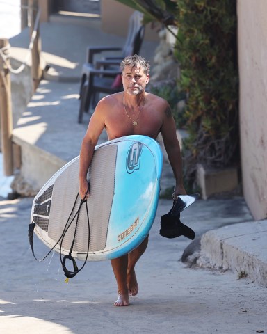 Santa Barbara, CA  - *EXCLUSIVE*  - Shirtless Rob Lowe shows off this toned body and his cupping bruises after a Paddleboarding session in Santa Barbara.  Pictured: Rob Lowe  BACKGRID USA 28 JUNE 2021   BYLINE MUST READ: ShotbyJuliann / BACKGRID  USA: +1 310 798 9111 / usasales@backgrid.com  UK: +44 208 344 2007 / uksales@backgrid.com  *UK Clients - Pictures Containing Children Please Pixelate Face Prior To Publication*