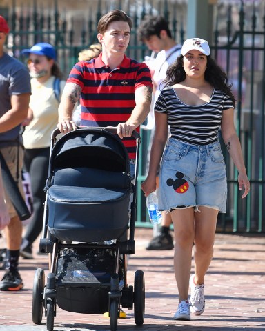 Drake Bell is seen for the first time since pleading guilty to child endangerment with a women who is believed to be his wife and a baby at Disneyland. The actor was seen celebrating his 35th birthday with his little family, putting his legal woes behind him as they enjoyed the happiest place on earth. **SPECIAL INSTRUCTIONS*** Please pixelate children's faces before publication.***. 27 Jun 2021 Pictured: Drake Bell. Photo credit: CelebCandidly / MEGA TheMegaAgency.com +1 888 505 6342 (Mega Agency TagID: MEGA765761_014.jpg) [Photo via Mega Agency]