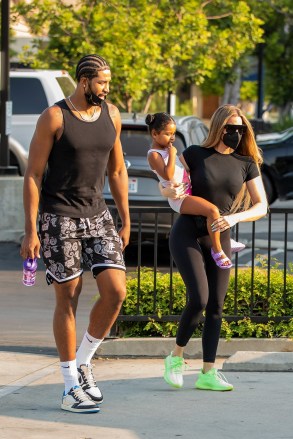 Calabasas, CA  - *EXCLUSIVE- Tristen Thompson was seen showing Khloe Kardashian some love as the co-parents arrived to watch their daughter True at dance class, as he placed his arm around her for a hug. While Khloe and Tristen are kind and affectionate to each other, they probably aren't back together. Tristen has met Khloe multiple times at True's dance class and they always drive separately. Tristen seems to want to chat with Khloe before she heads home to Calabasas, but the pair always cut things off after a few minutes with Tristen heading the opposite way. However difficult it may be to be co-parenting x's, Khloe and Tristen are doing a bang-up job at keeping it kind for True. It looks like Khloe has the upper hand in the relationship, as Tristen seems to be the one putting in all of the efforts.Pictured: Khloe Kardashian, Tristan Thompson, True ThompsonBACKGRID USA 23 AUGUST 2021 BYLINE MUST READ: IXOLA / BACKGRIDUSA: +1 310 798 9111 / usasales@backgrid.comUK: +44 208 344 2007 / uksales@backgrid.com*UK Clients - Pictures Containing ChildrenPlease Pixelate Face Prior To Publication*