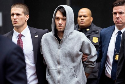 FILE - In this Thursday, Dec. 17, 2015, file photo, Martin Shkreli, center, the former hedge fund manager under fire for buying a pharmaceutical company and ratcheting up the price of a life-saving drug, is escorted by law enforcement agents in New York  after being taken into custody following a securities probe. U.S. Rep. Elijah Cummings, D-Maryland, said a lawyer for Shkreli indicated he has not sought permission from a New York judge to appear at a congressional hearing Tuesday, Jan. 26, 2016, on drug prices, despite receiving a subpoena. (AP Photo/Craig Ruttle, File)