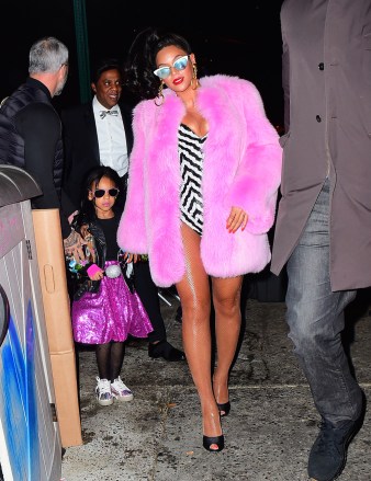 Beyonce and Jay Z were spotted arriving to their Annual Halloween Party in NYC . The couple dressed as a super stylish Black Barbie and Black Ken Doll set. Beyonce stunned in a Pink Fur Coat and a striped Bodysuit. She wore a mirrored pair of sunglasses as she walked with her Husband Jay Z and cute daughter Blue Ivy into the party. They were joined by Kelly Rowland as well, who dressed up as RUN DMCPictured: Beyonce,Jay Z,BeyonceJay ZKelly RowlandRef: SPL1384685 011116 NON-EXCLUSIVEPicture by: SplashNews.comSplash News and PicturesLos Angeles: 310-821-2666New York: 212-619-2666London: +44 (0)20 7644 7656Berlin: +49 175 3764 166photodesk@splashnews.comWorld Rights