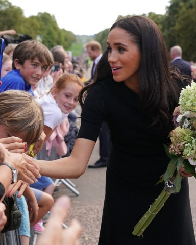 The Princess of Wales Kate Middleton, the Prince of Wales Prince WIllian and the Duke and Duchess of Sussex Prince Harry and Meghan Markle meeting members of the public at Windsor Castle in Berkshire following the death of Queen Elizabeth II on Thursday. 10 Sep 2022 Pictured: The Duke and Duchess of Sussex and the Prince and Princess of Wales. Meghan Markle, Prince Harry, Prince William and Kate Middleton. Photo credit: Kirsty O'Connor/WPA-Pool/MEGA TheMegaAgency.com +1 888 505 6342 (Mega Agency TagID: MEGA894302_018.jpg) [Photo via Mega Agency]