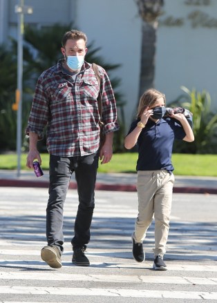 *EXCLUSIVE* Santa Monica, CA  - Ben Affleck looks happy as he talks on his phone on a school run with his son Samuel, after returning from Gran Canaria, Spain where he spent time with his girlfriend Jennifer Lopez as she films 'The Mother'Pictured: Ben AffleckBACKGRID USA 16 MARCH 2022 USA: +1 310 798 9111 / usasales@backgrid.comUK: +44 208 344 2007 / uksales@backgrid.com*UK Clients - Pictures Containing ChildrenPlease Pixelate Face Prior To Publication*
