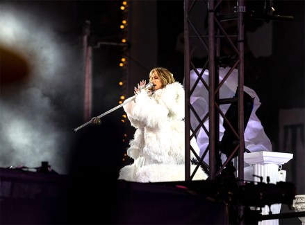 Jennifer Lopez performs on stage during the 2021 New Year celebration on Times Square.  Because of the COVID-19 pandemic no revelers were allowed to be on Times Square, only a few essential workers received special invitations and were seated inside socially distanced pods.  2021 New Year celebration on Times Square, New York, United States - 01 Jan 2021