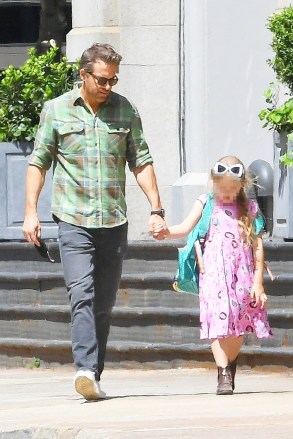 NEW YORK, NY - *EXCLUSIVE* - Ryan Reynolds keeps it casual in a plaid shirt and black jeans when out for a walk with his daughter.  Image: Ryan Reynolds Backgrid USA 12 May 2021 USA: +1 310 798 9111 / usasales@backgrid.com UK: +44 208 344 2007 / uksales@backgrid.com *UK Clients - Images with children please pixelate before publication*