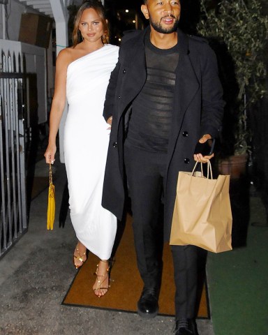 Chrissy Teigen and John Legend are seen leaving dinner at Giorgio Baldi  Pictured: Chrissy Teigen,John Legend Ref: SPL5304540 190422 NON-EXCLUSIVE Picture by: PhotosByDutch / SplashNews.com  Splash News and Pictures USA: +1 310-525-5808 London: +44 (0)20 8126 1009 Berlin: +49 175 3764 166 photodesk@splashnews.com  World Rights