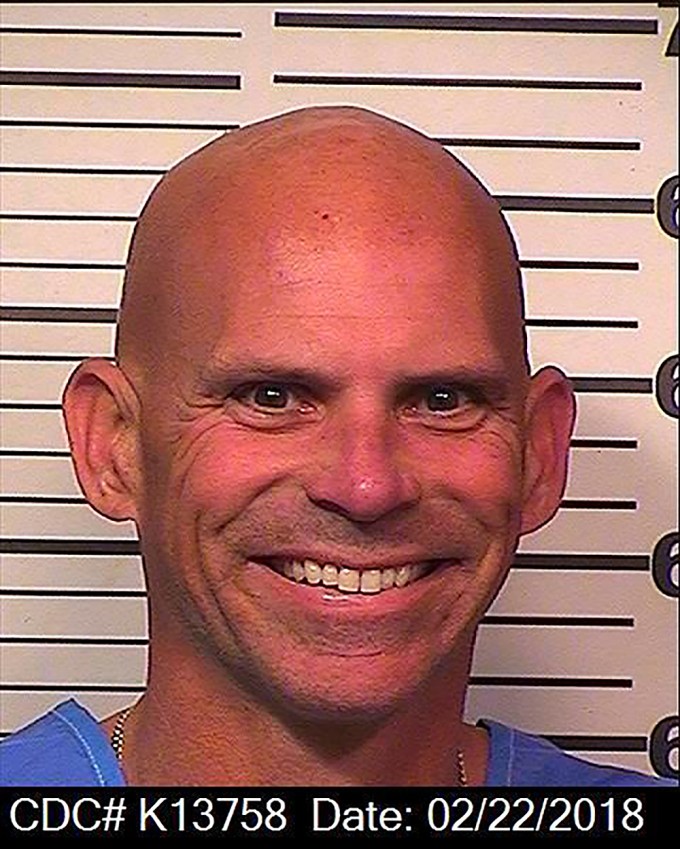 Lyle Menendez smiles in this Feb.. 2018 prison photo