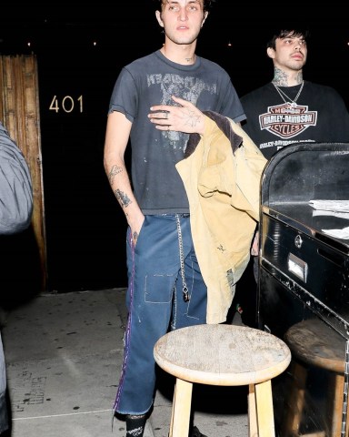 West Hollywood, CA  - A newly single Anwar Hadid enjoys a night out with the guys at The Nice Guy in West Hollywood. A mystery woman is seen out with Anwar and friends amid his recent split from Dua Lipa.  Pictured: Anwar Hadid  BACKGRID USA 15 JANUARY 2022   BYLINE MUST READ: NGRE / BACKGRID  USA: +1 310 798 9111 / usasales@backgrid.com  UK: +44 208 344 2007 / uksales@backgrid.com  *UK Clients - Pictures Containing Children Please Pixelate Face Prior To Publication*