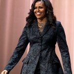 Former first lady Michelle Obama walks on stage during a stop on her book tour for "Becoming," in Washington Michelle Obama Book Tour, Washington, USA - 25 Nov 2018