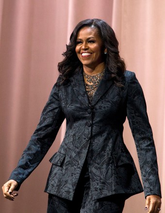 Former first lady Michelle Obama walks on stage during a stop on her book tour for "Becoming," in Washington
Michelle Obama Book Tour, Washington, USA - 25 Nov 2018