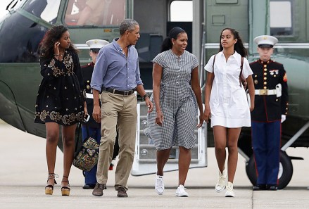 Barack Obama, Michelle Obama, Malia Obama, Sasha Obama President Barack Obama with first lady Michelle Obama and their daughters Malia, right, and Sasha walk on the tarmac to board Air Force One at Air Station Cape Cod in Mass., . Obama is returning from vacation rested and ready for a busy fall, including pressing Congress for money to protect against the Zika virus and fending off lawmakers' attacks over the administration's $400 million "leverage" payment to Iran
Barack Obama and family return from vacation, Cape Cod, USA - 21 Aug 2016