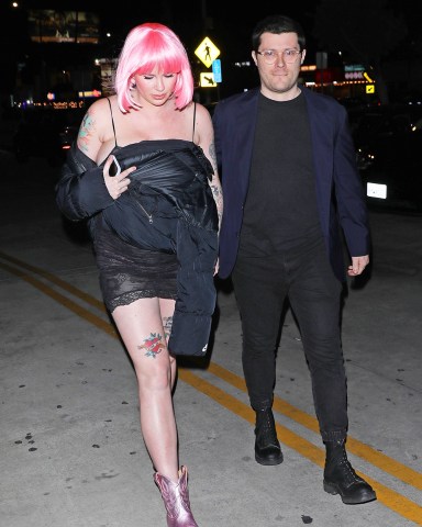 Hollywood, CA  - *EXCLUSIVE*  - A pregnant Ireland Baldwin rocks a pink wig as she and boyfriend RAC are seen arriving at an adult entertainment club called Jumbo's Clown Room to celebrate her baby shower with celebrity friends such as Hilary Duff, Rumer Willis, mom Kim Basinger and many other friends as well in Hollywood. The 27-year-old mom to be is wearing a see through lingerie, pink cowboy style boots and a pink wig. At one point, you can clearly see Ireland's pink under garment through the back of her lingerie as she walks into the club. The Jumbo's Clown Room is usually closed on Monday's but certain arrangements were made for it to be open for Ireland Baldwin's baby shower celebration.Pictured: Ireland Baldwin, RACBACKGRID USA 7 MARCH 2023 USA: +1 310 798 9111 / usasales@backgrid.comUK: +44 208 344 2007 / uksales@backgrid.com*UK Clients - Pictures Containing ChildrenPlease Pixelate Face Prior To Publication*